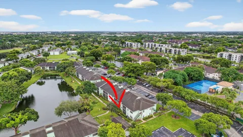 an aerial view of residential houses with outdoor space and street view