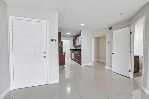 a view of a livingroom and a kitchen