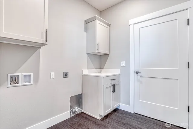 a view of a storage & utility room with wooden floor