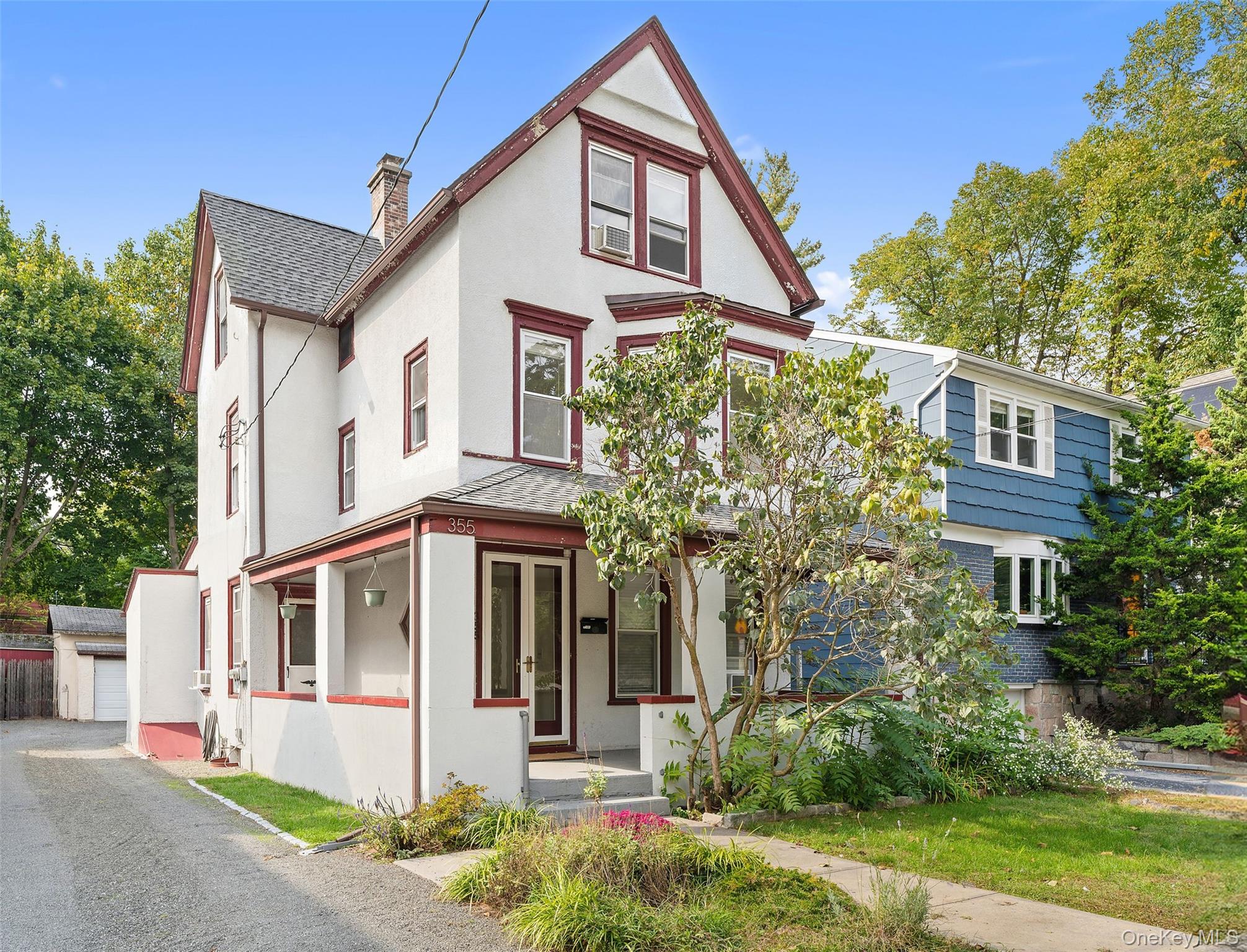 355 Bronxville Road Bronxville, NY 10708 - Photo 1 of 22 a front view of a house with a yard