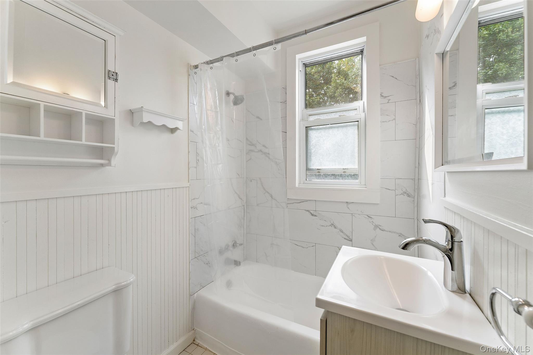 355 Bronxville Road Bronxville, NY 10708 - Photo 11 of 22 a bathroom with a sink and a bathtub