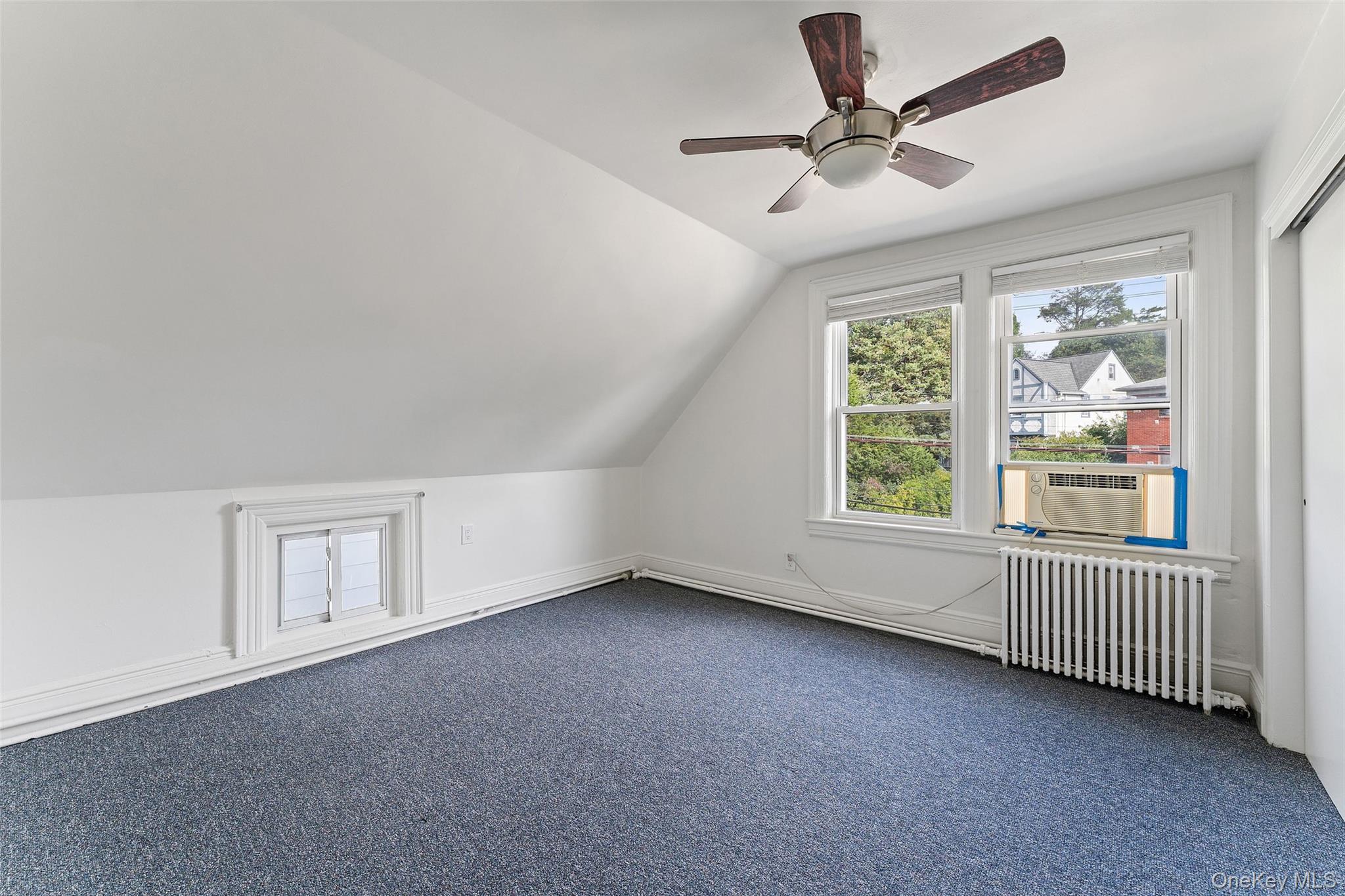 355 Bronxville Road Bronxville, NY 10708 - Photo 12 of 22 a view of an empty room with a window