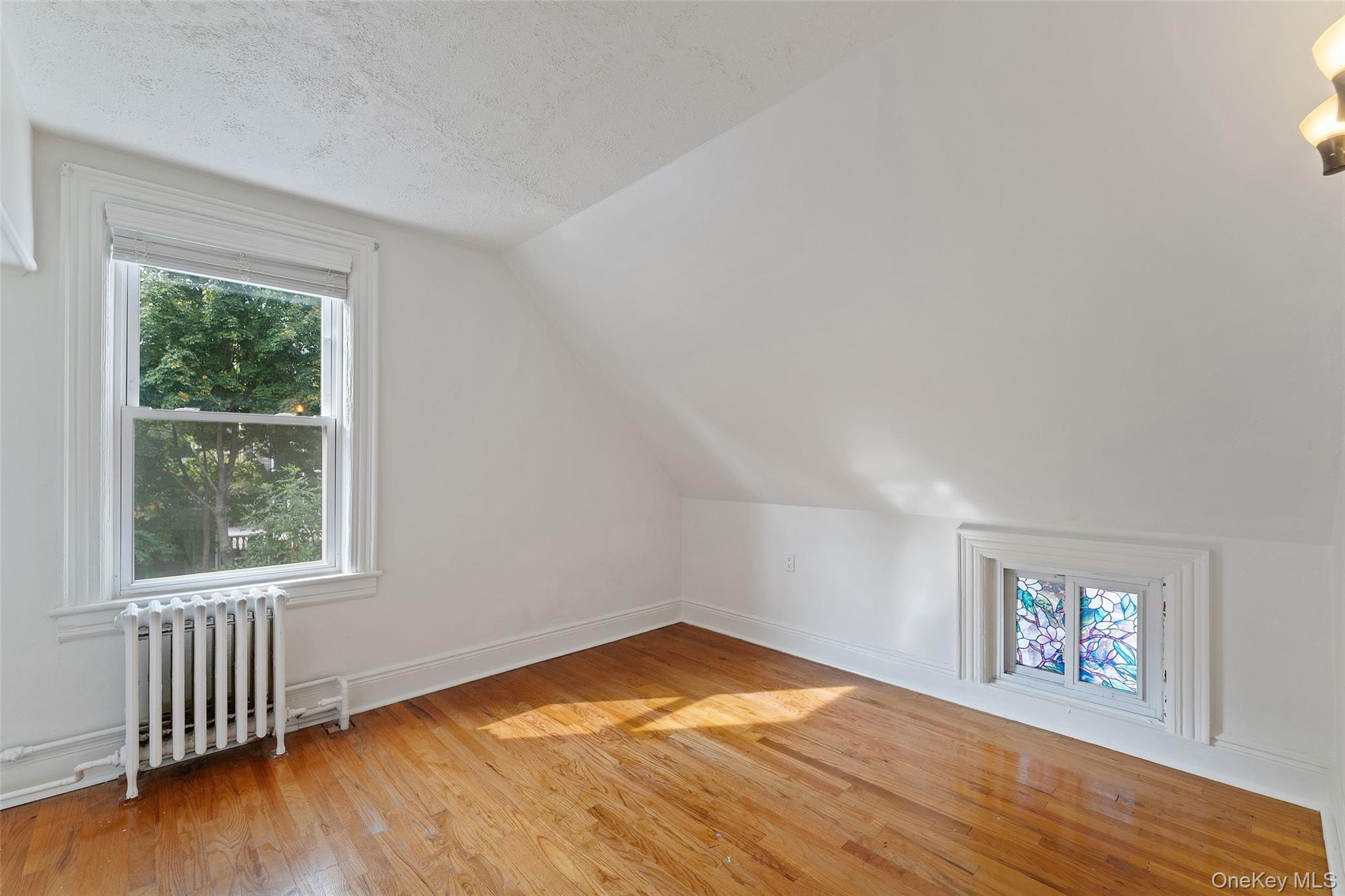 355 Bronxville Road Bronxville, NY 10708 - Photo 15 of 22 a view of empty room with wooden floor and fan