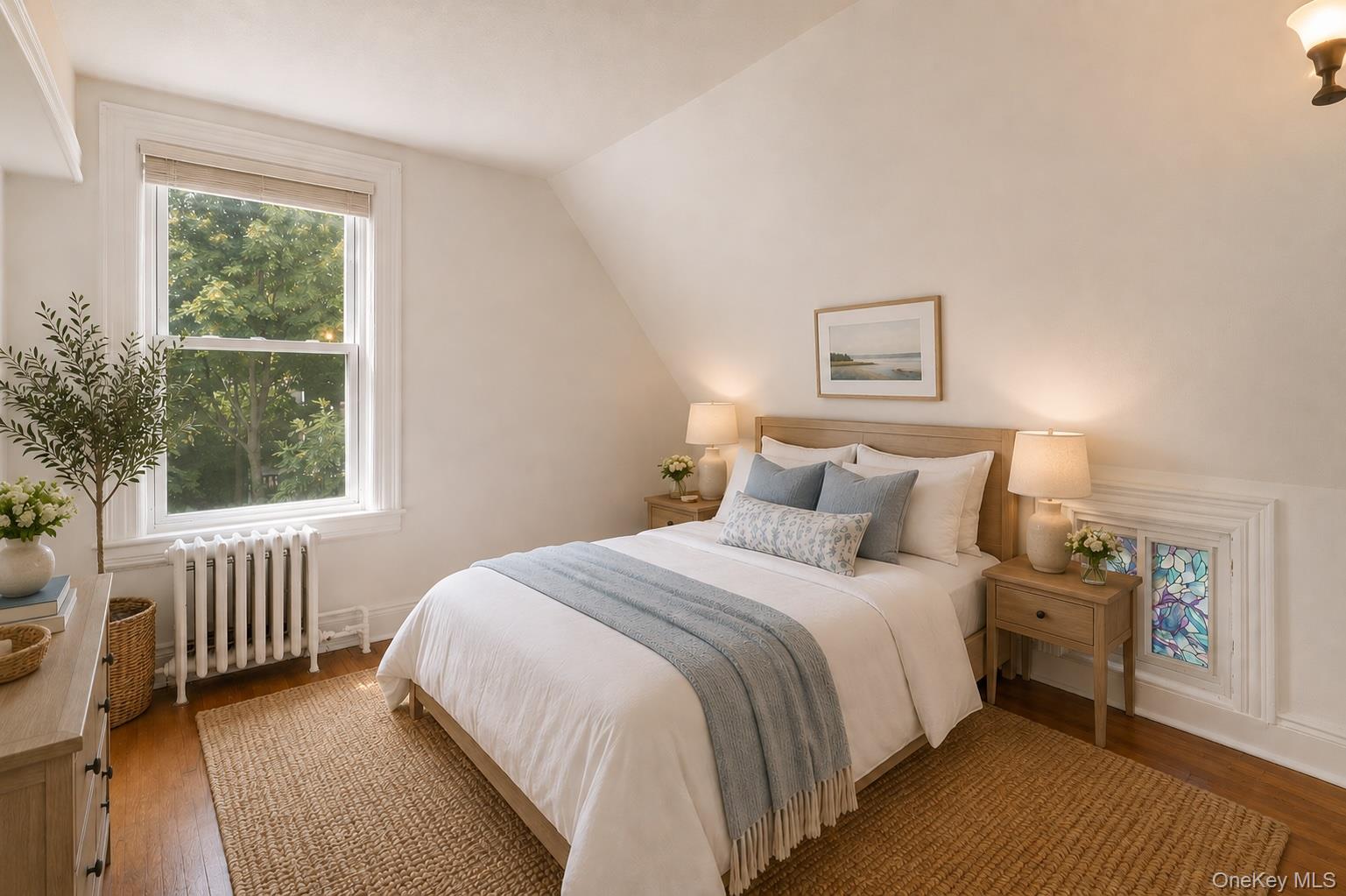 355 Bronxville Road Bronxville, NY 10708 - Photo 16 of 22 a bedroom with a bed and a window
