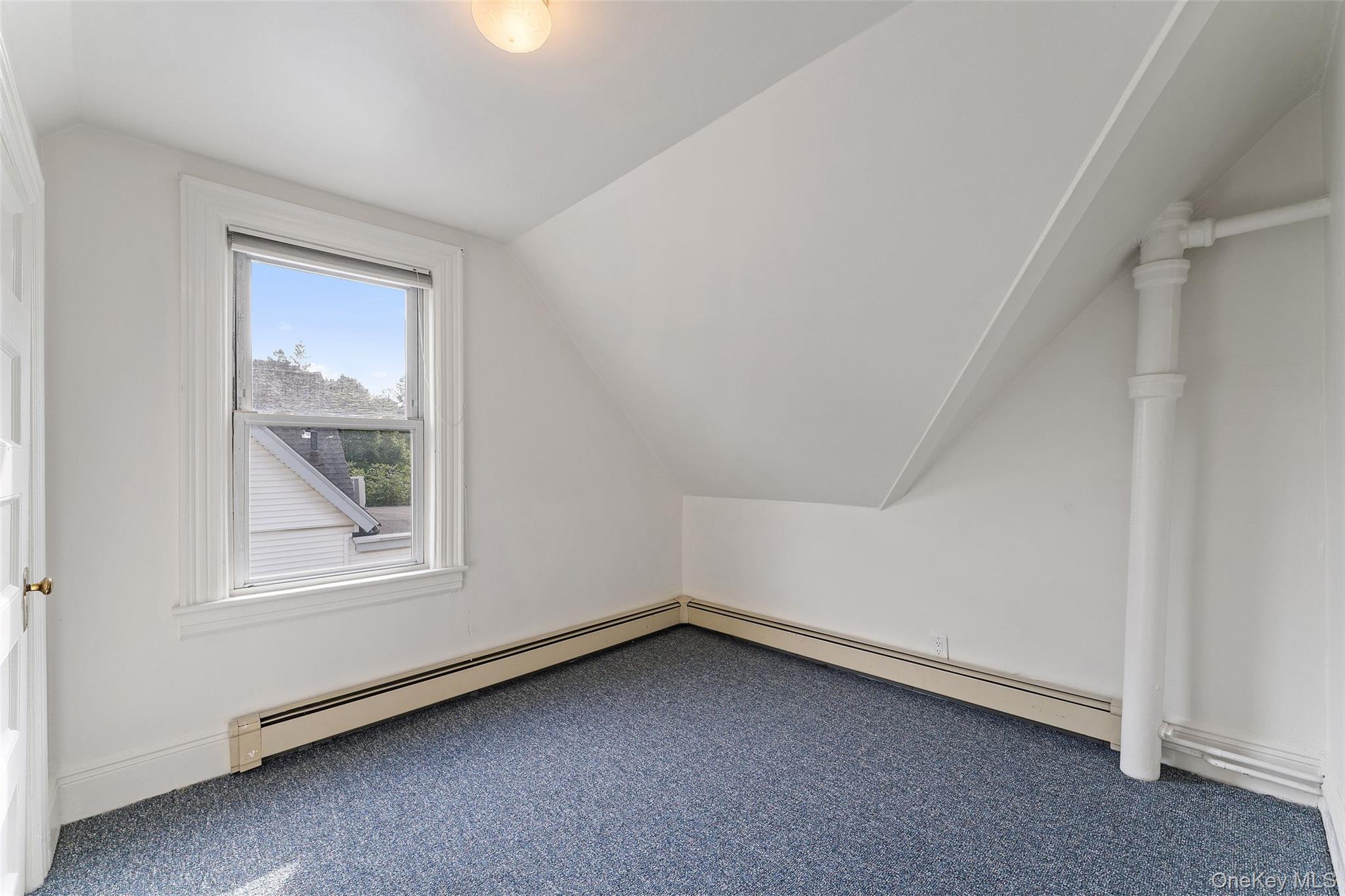 355 Bronxville Road Bronxville, NY 10708 - Photo 17 of 22 an empty room with a window