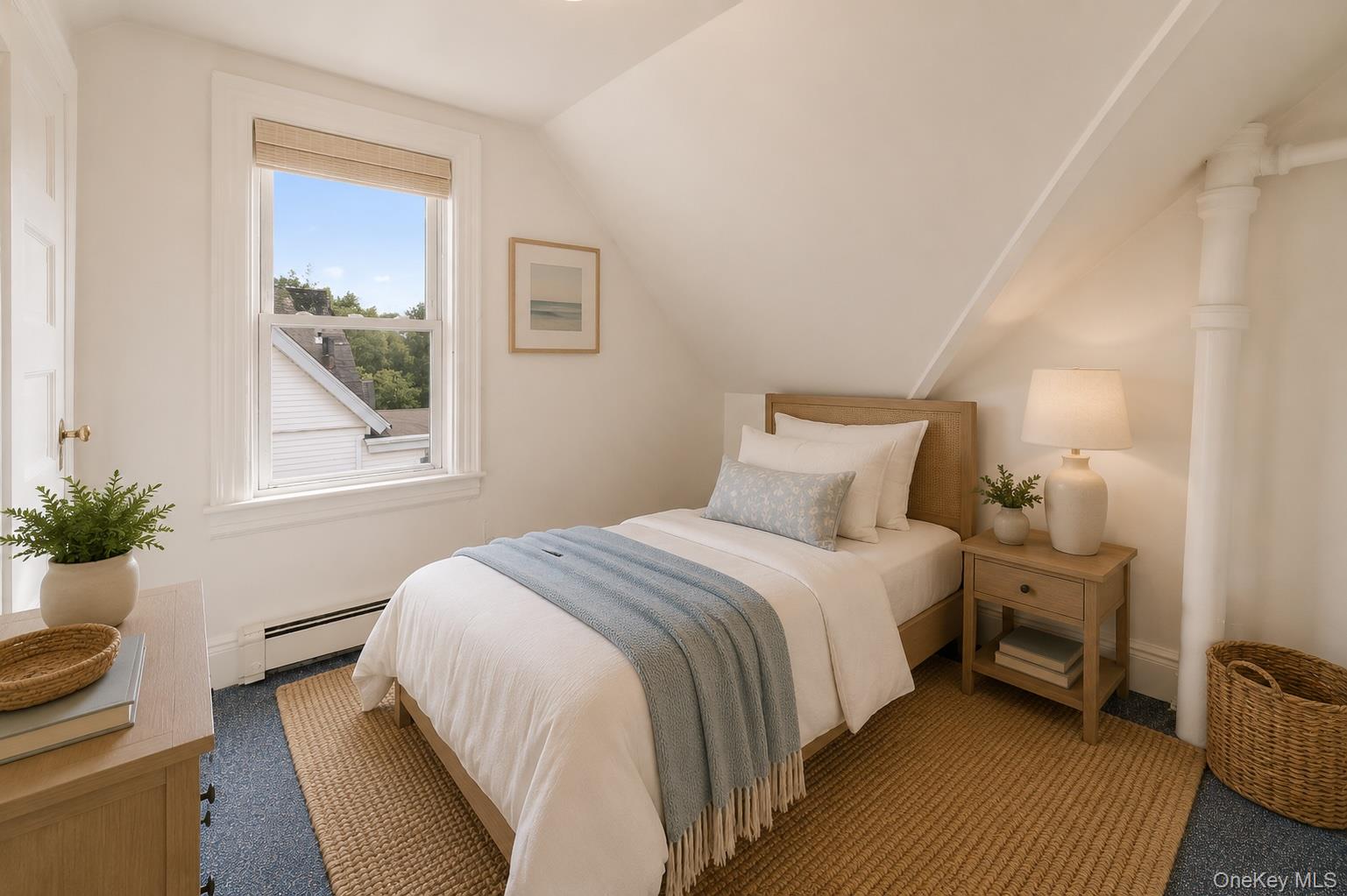 355 Bronxville Road Bronxville, NY 10708 - Photo 18 of 22 a bedroom with a bed and a window