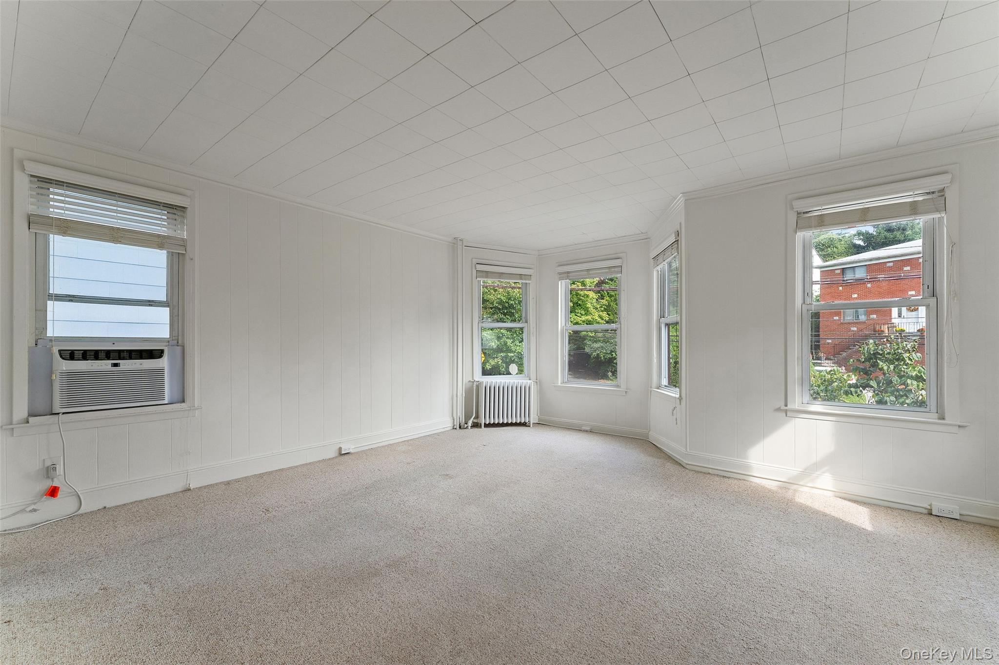 355 Bronxville Road Bronxville, NY 10708 - Photo 3 of 22 an empty room with windows