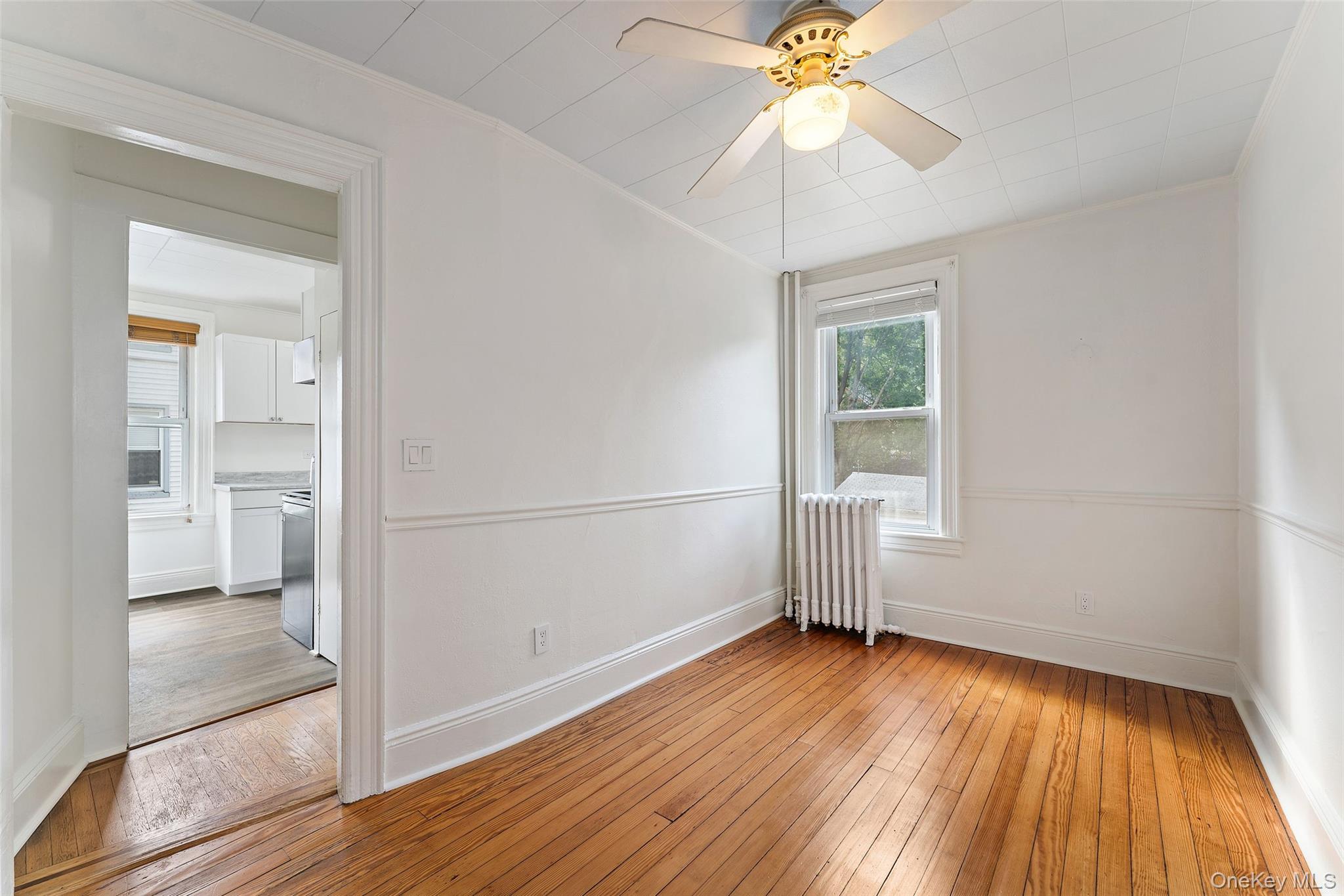 355 Bronxville Road Bronxville, NY 10708 - Photo 8 of 22 wooden floor in an empty room with a window