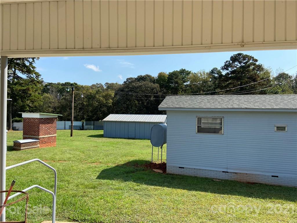 883 State Rd S-29-376 Lancaster, SC 29720 - Photo 14 of 16 a view of a house with backyard