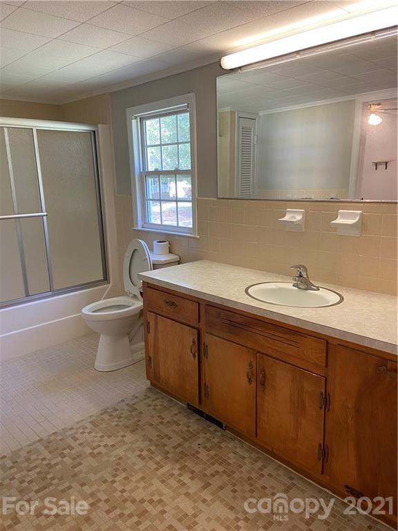 883 State Rd S-29-376 Lancaster, SC 29720 - Photo 15 of 16 a bathroom with a sink and a mirror