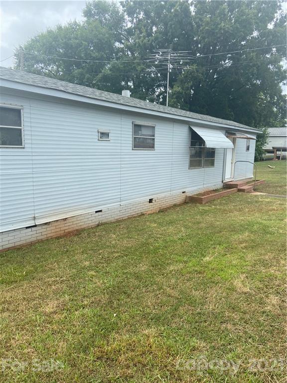 883 State Rd S-29-376 Lancaster, SC 29720 - Photo 16 of 16 a view of a house with a backyard