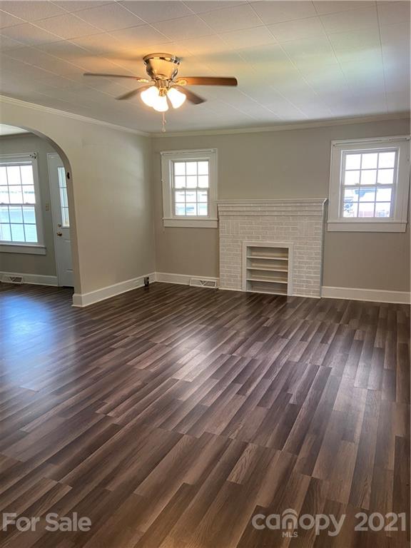 883 State Rd S-29-376 Lancaster, SC 29720 - Photo 7 of 16 a view of empty room with wooden floor and fan