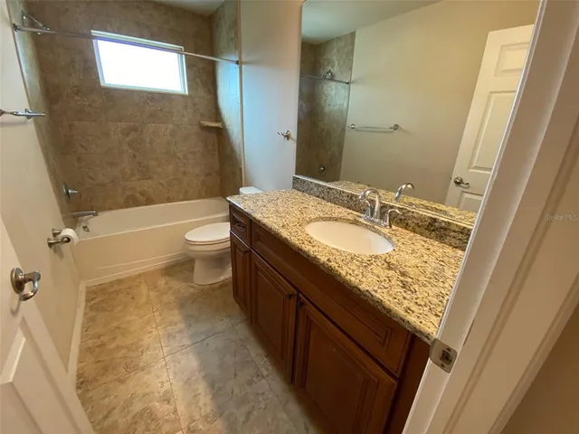a bathroom with a tub and a shower