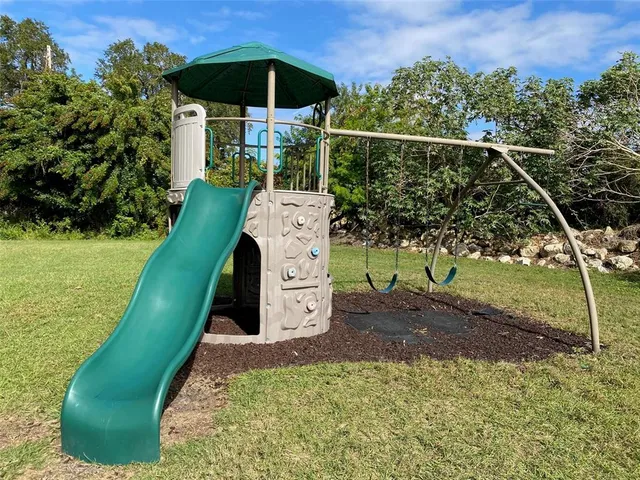 an aerial view of house with yard swimming pool and outdoor seating