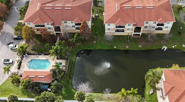 an aerial view of a house with garden space and street view