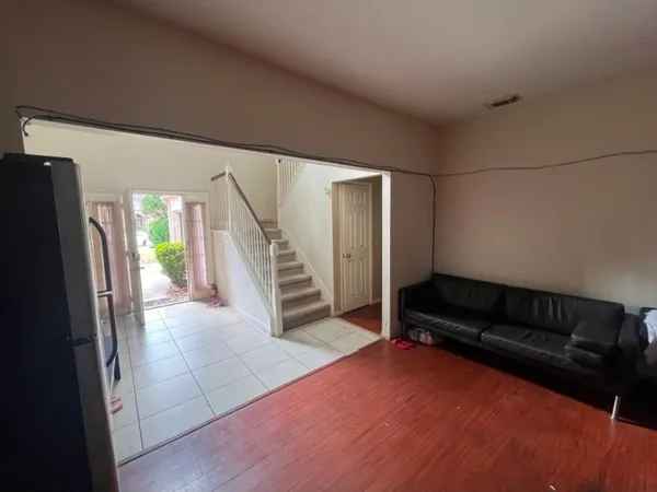 a view of livingroom with furniture and stairs