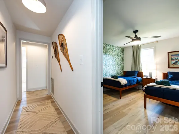 a bedroom with a bed couch and window