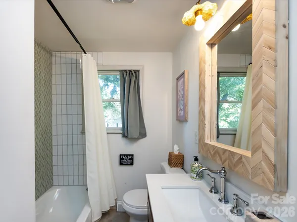 a bathroom with a sink and a shower