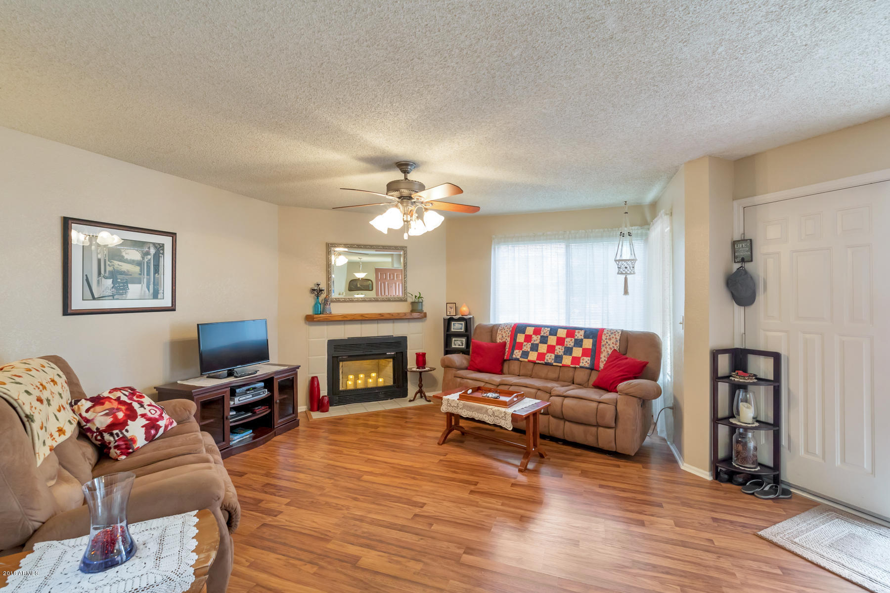 2834 South Ext Road, Unit 1050 Mesa, AZ 85210 - Photo 5 of 14 Living room with fireplace