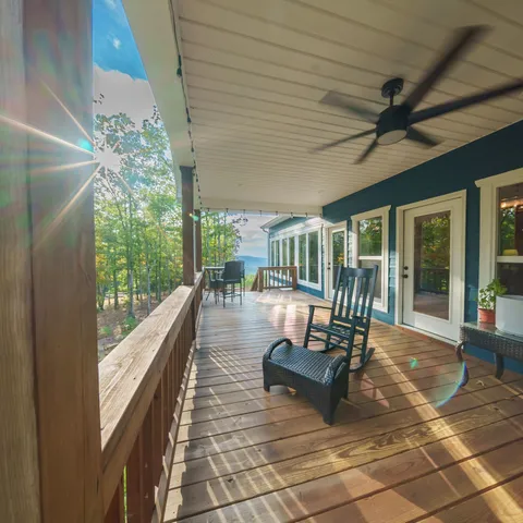 a living room with lots of furniture and chandelier