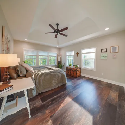 a spacious bathroom with a granite countertop sink and a mirror