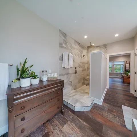 a room with lots of furniture and white walls