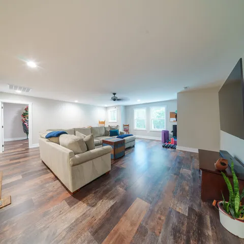 a bed room with furniture and a chandelier
