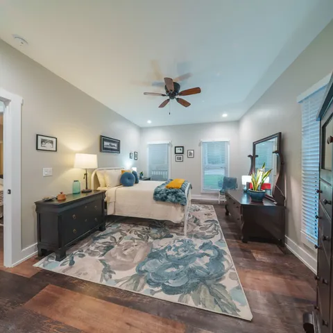 a spacious bedroom with a bed and a walk in closet