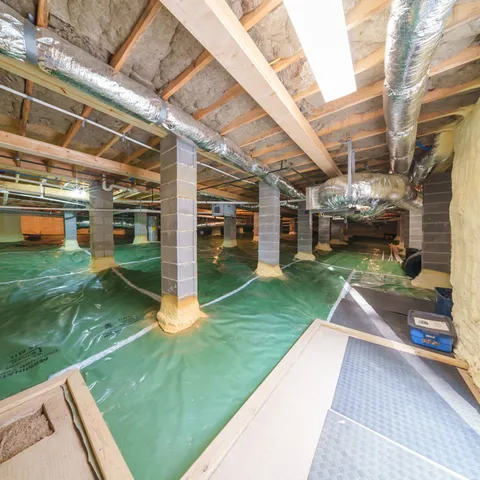 a view of a lake with a house in the background