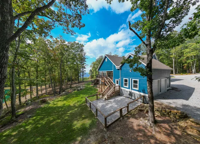 a view of a swimming pool with a bench in a park