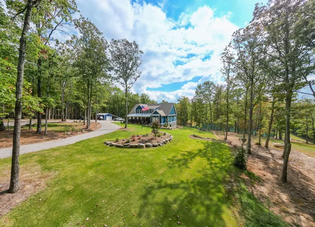 a view of swimming pool with a lake view