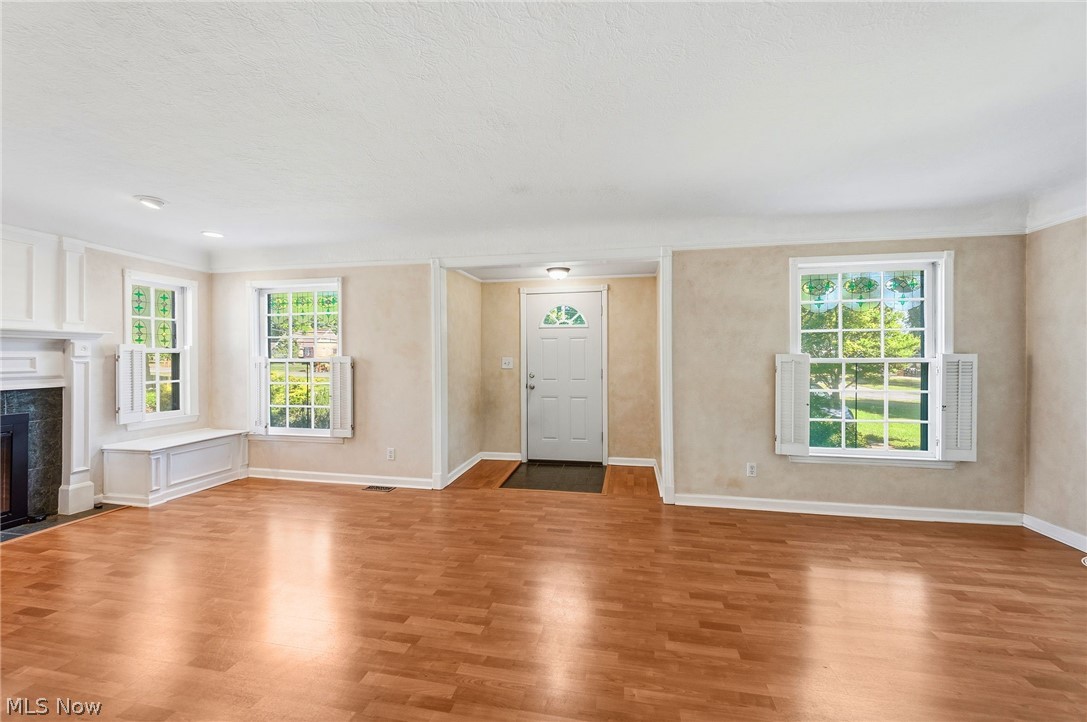 6832 Hillside Road Independence, OH 44131 - Photo 5 of 44 Entry foyer and living room with fireplace