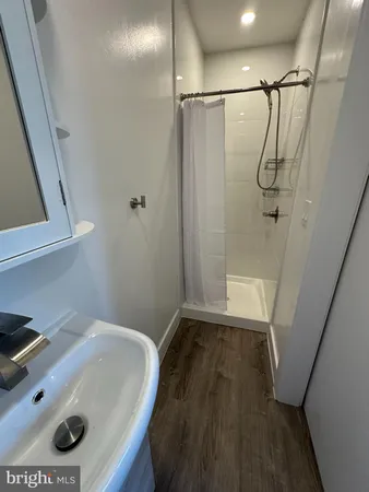 a bathroom with a sink and a shower