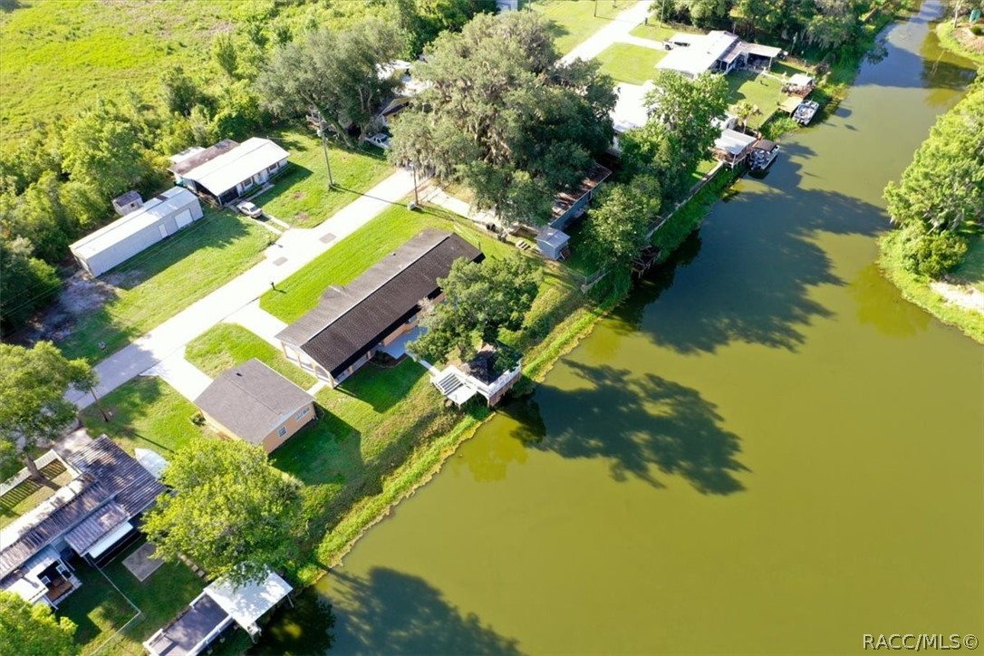 928 South Shad Terrace Inverness, FL 34450 - Photo 39 of 48 an aerial view of a house with a lake view
