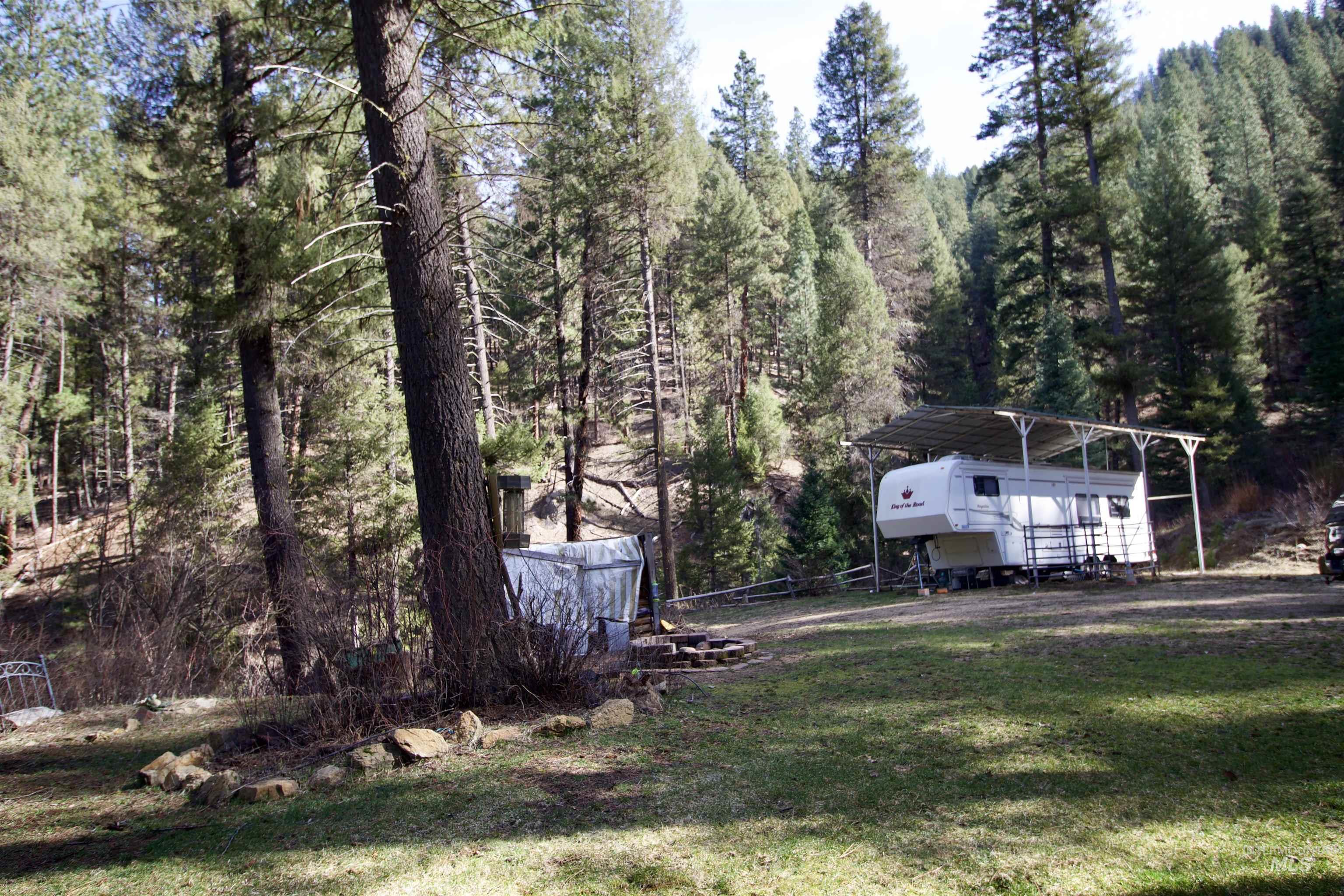 36 Lightning Creek Road Garden Valley, ID 83622 - Photo 6 of 12 View of grassy yard with a detached carport