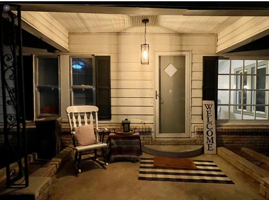 a front view of a house with outdoor seating