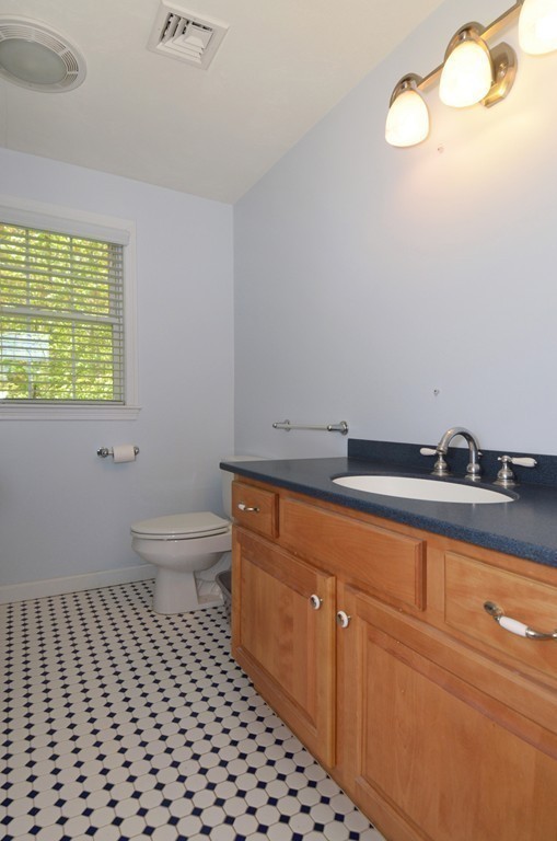 33 Quabbin Path Sutton, MA 01590 - Photo 23 of 27 a bathroom with a sink a toilet and a window