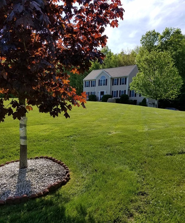 33 Quabbin Path Sutton, MA 01590 - Photo 3 of 27 a front view of a house with garden