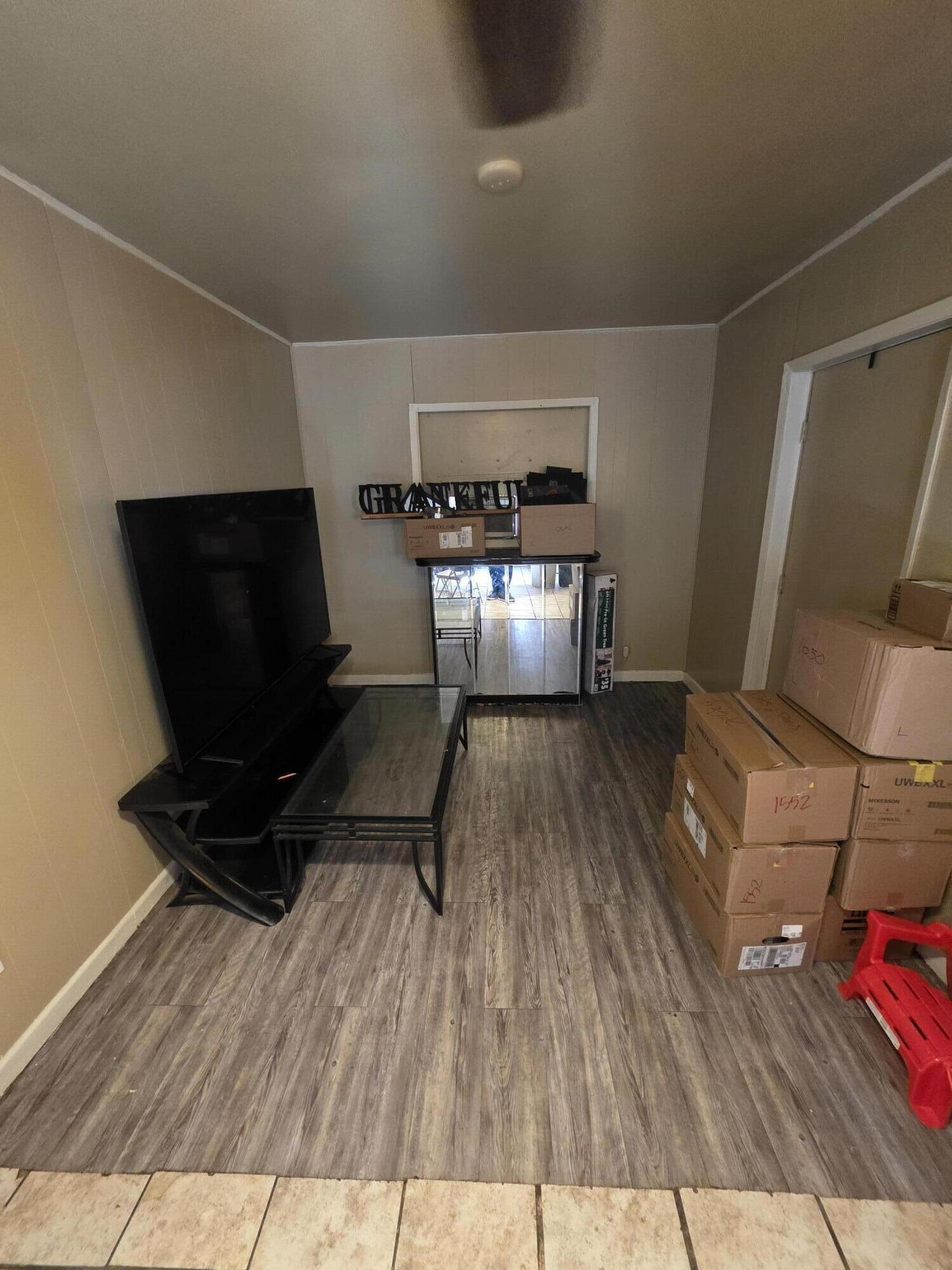 2105 East 29th Street Lubbock, TX 79404 - Photo 11 of 26 a living room with furniture and a flat screen tv
