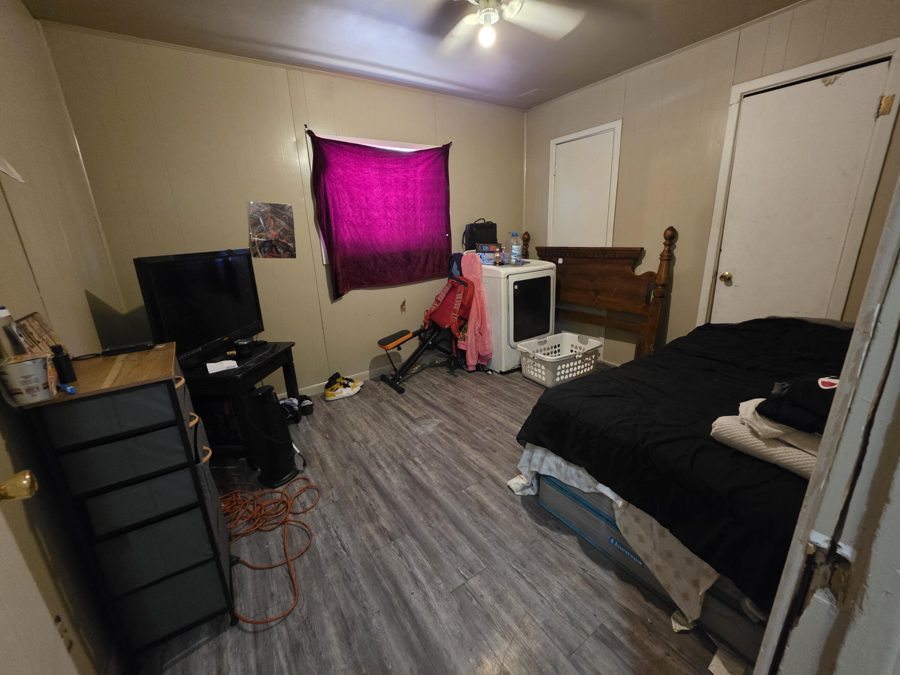 2105 East 29th Street Lubbock, TX 79404 - Photo 12 of 26 a living room with furniture and wooden floor