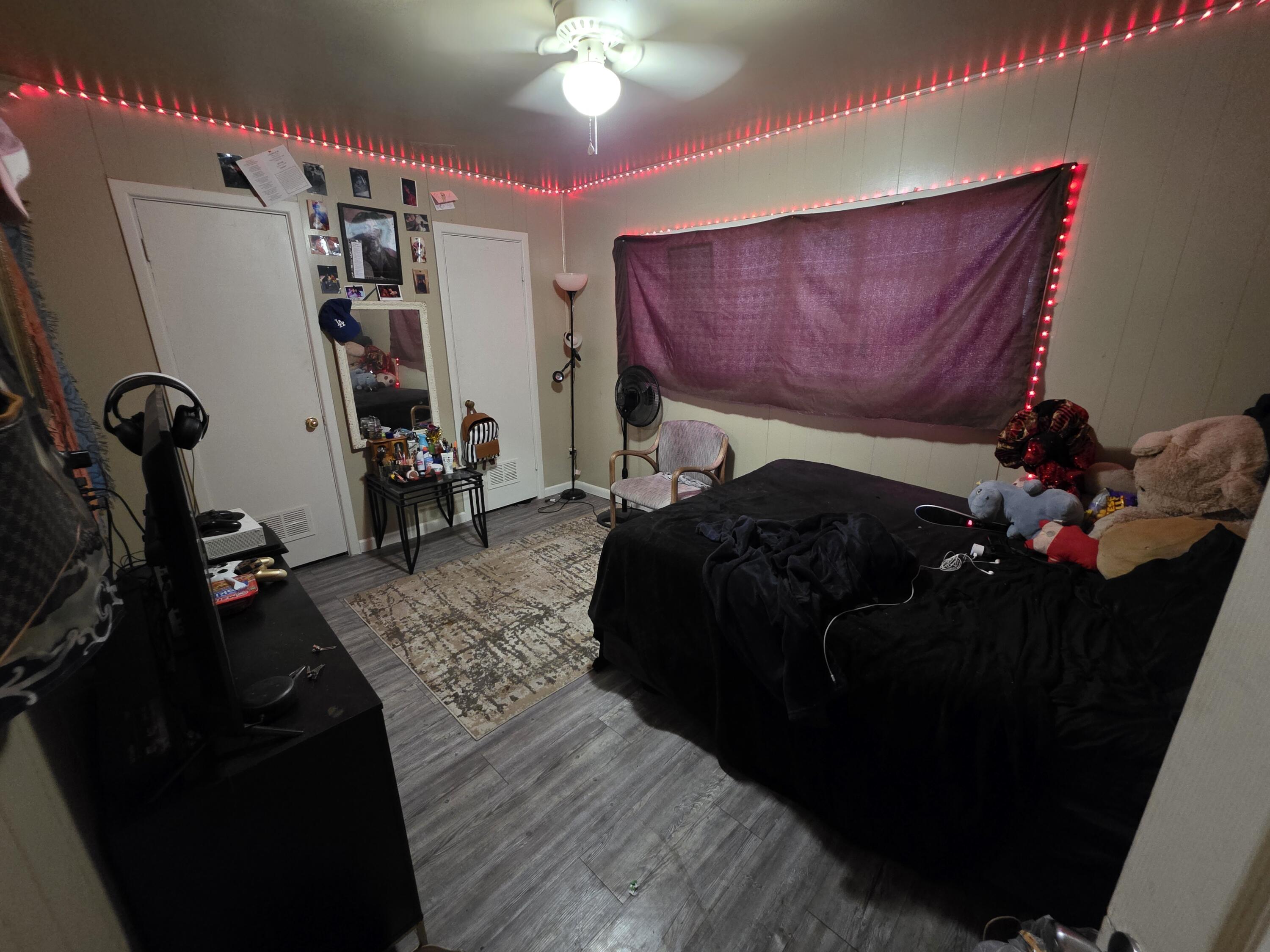 2105 East 29th Street Lubbock, TX 79404 - Photo 14 of 26 a bed room with a bed and a gym machine