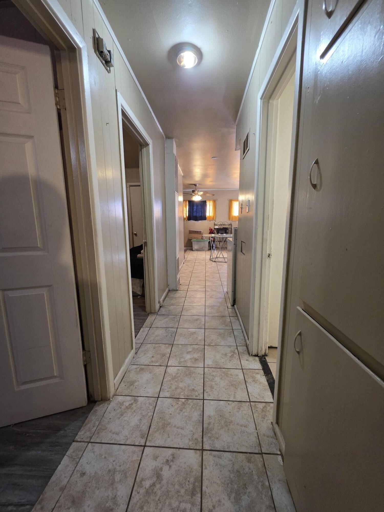 2105 East 29th Street Lubbock, TX 79404 - Photo 19 of 26 a bathroom with a glass door shower a sink and a mirror