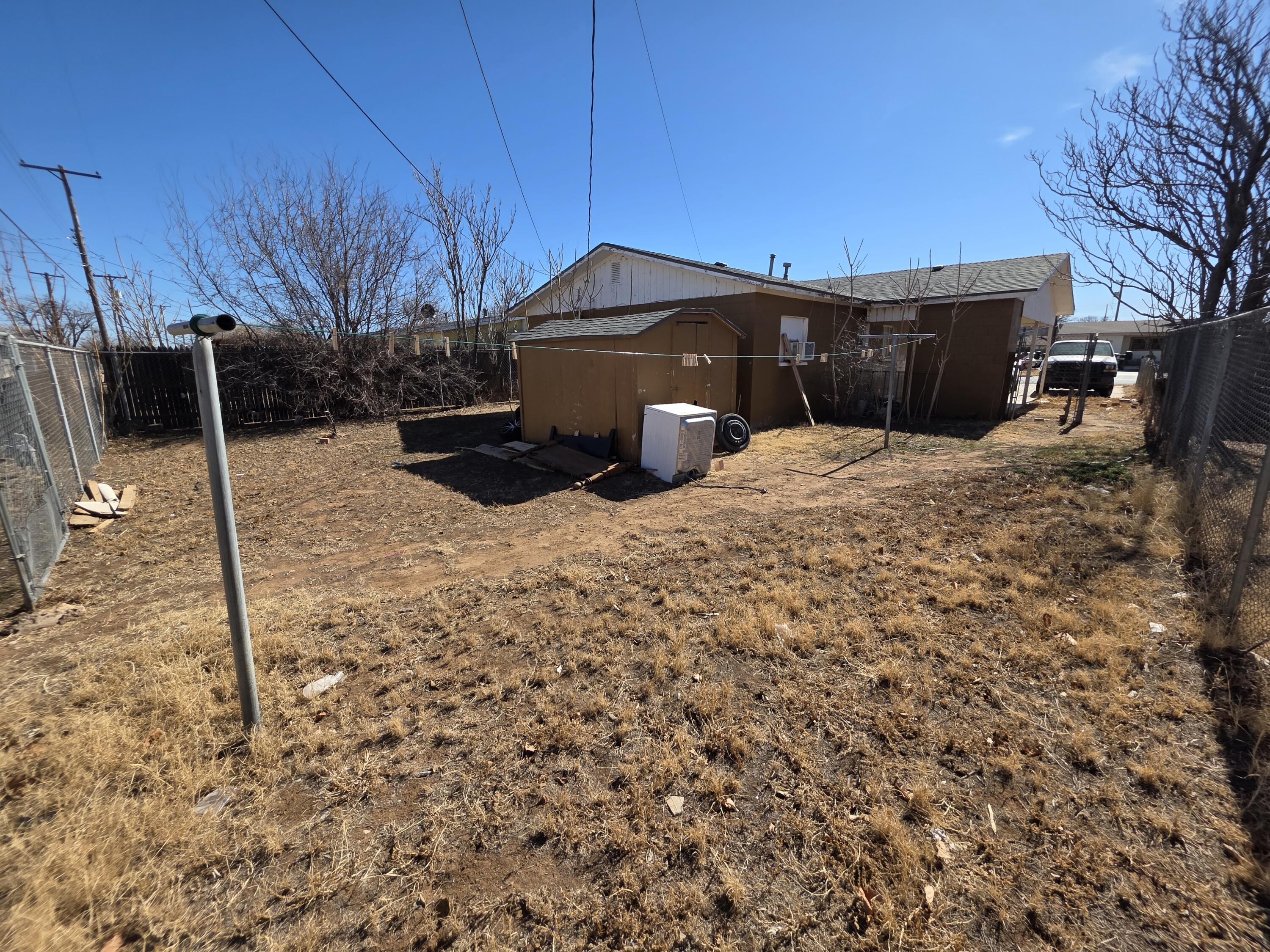 2105 East 29th Street Lubbock, TX 79404 - Photo 22 of 26 a view of a barn in the middle of a yard