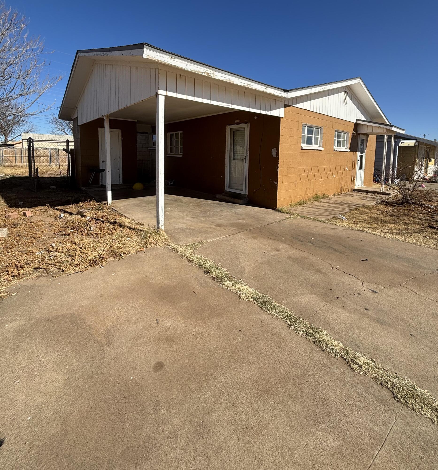 2105 East 29th Street Lubbock, TX 79404 - Photo 3 of 26 a front view of a house with a garage