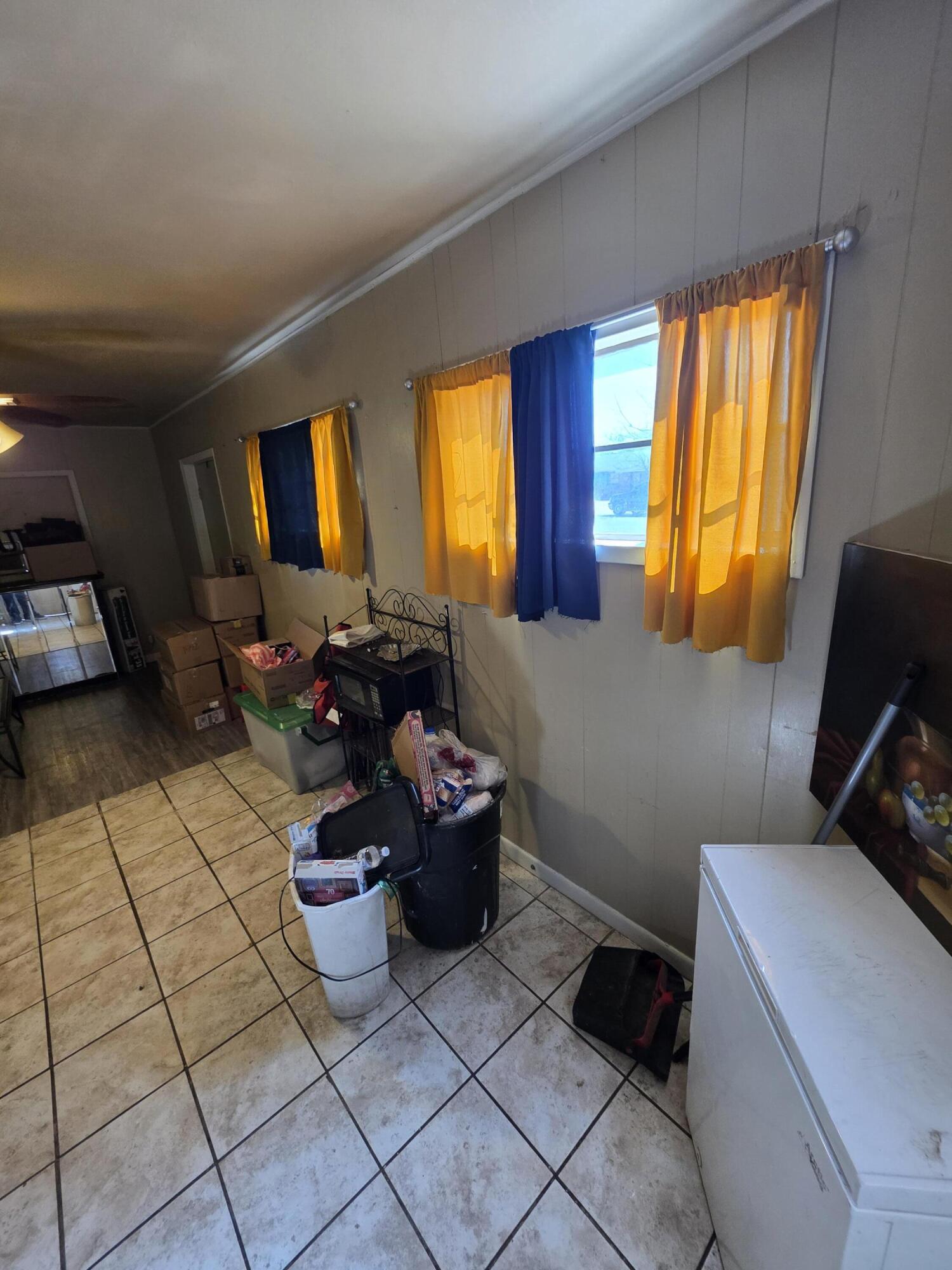 2105 East 29th Street Lubbock, TX 79404 - Photo 5 of 26 a room with furniture and window
