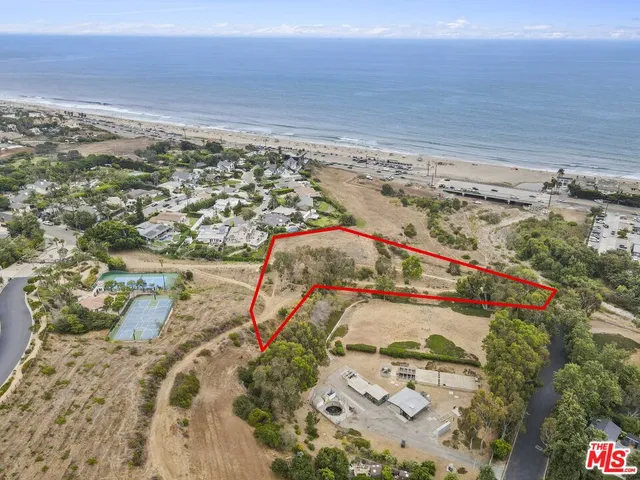 an aerial view of beach and ocean