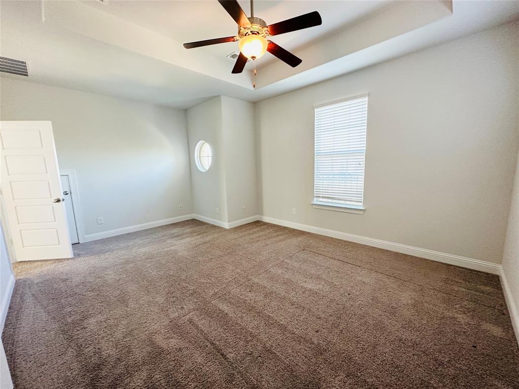 806 Davids Way Allen, TX 75013 - Photo 15 of 24 an empty room with windows and fan