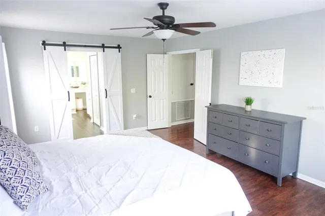 a bedroom with a bed and a dresser