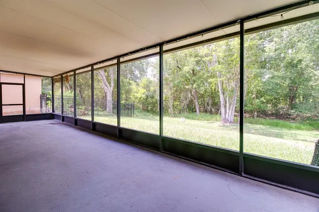 a view of an empty room with a large window