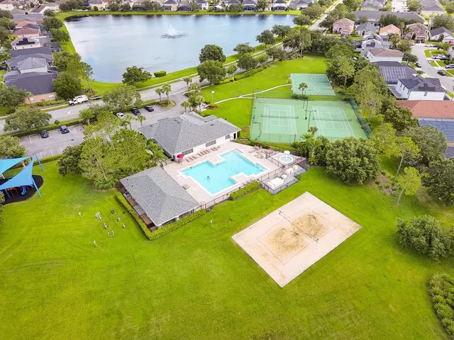 an aerial view of a house with a lake view